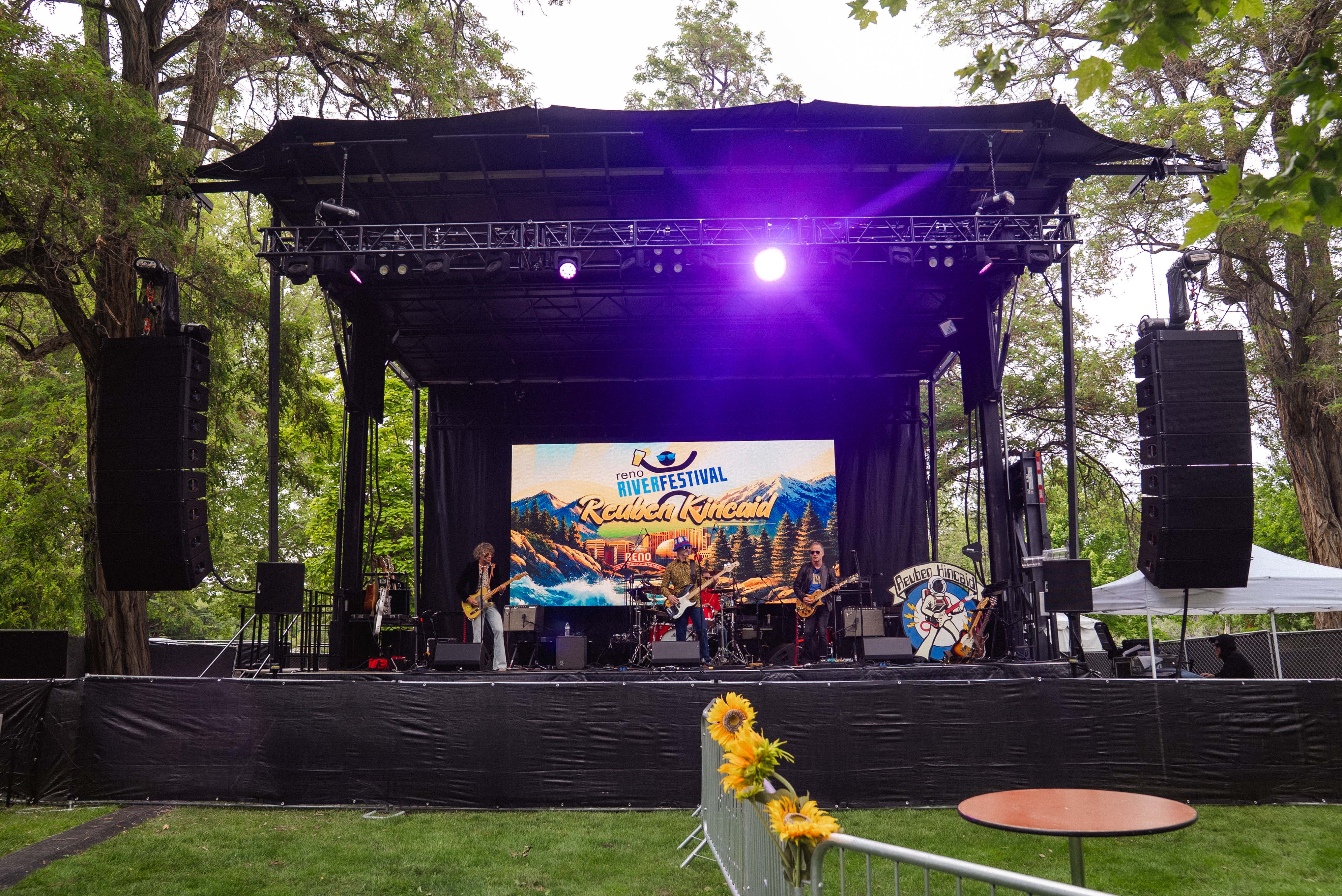Concert stage lit in deep violet by Moon Lighting & Sound